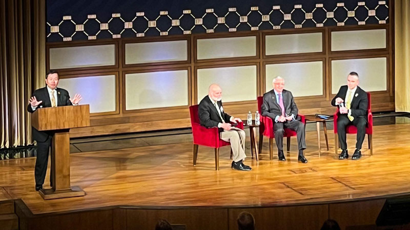 President Mun Y. Choi addresses an auditorium of guests from behind a lecturn